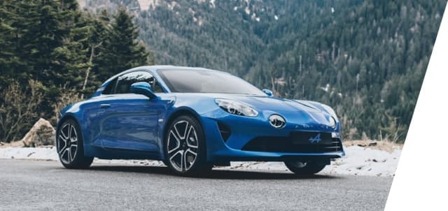 Alpine A110 on a gravel road